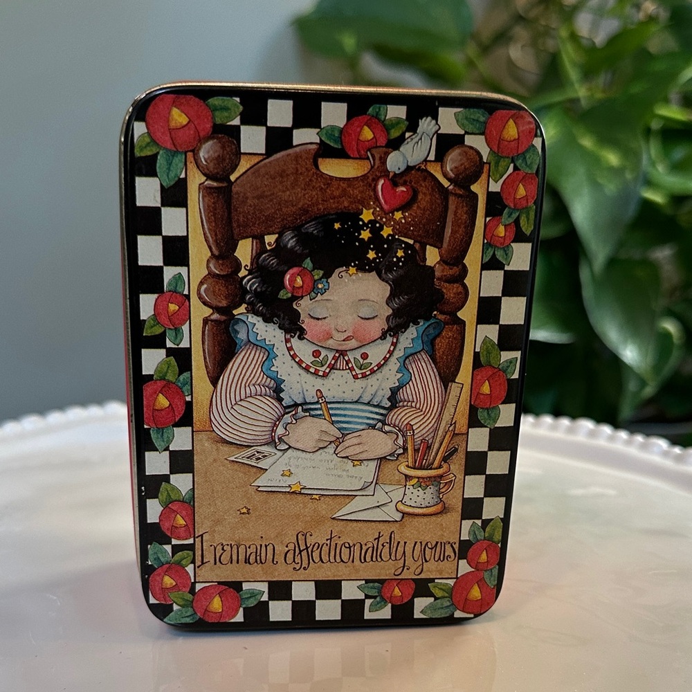 Mary Engelbreit Tin with Red and Black Checkered Design